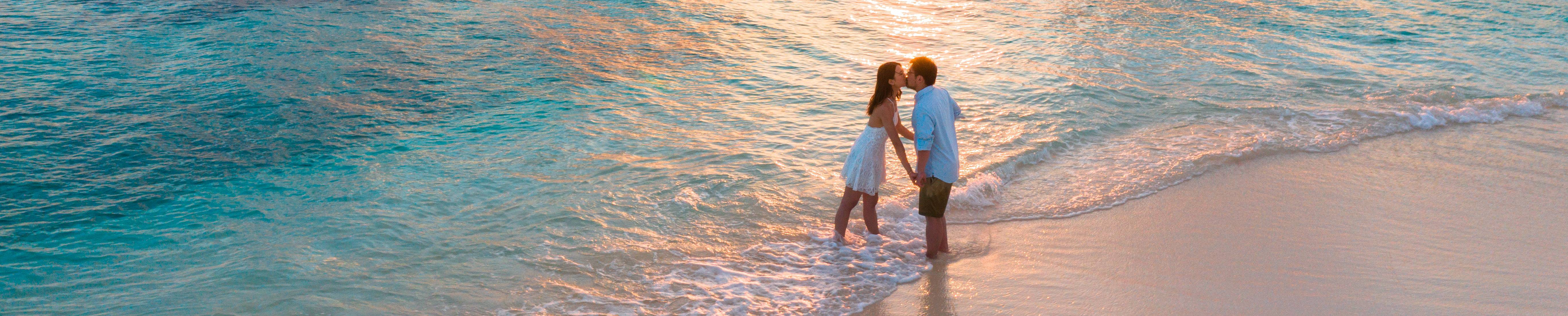 couple kissing on the beach